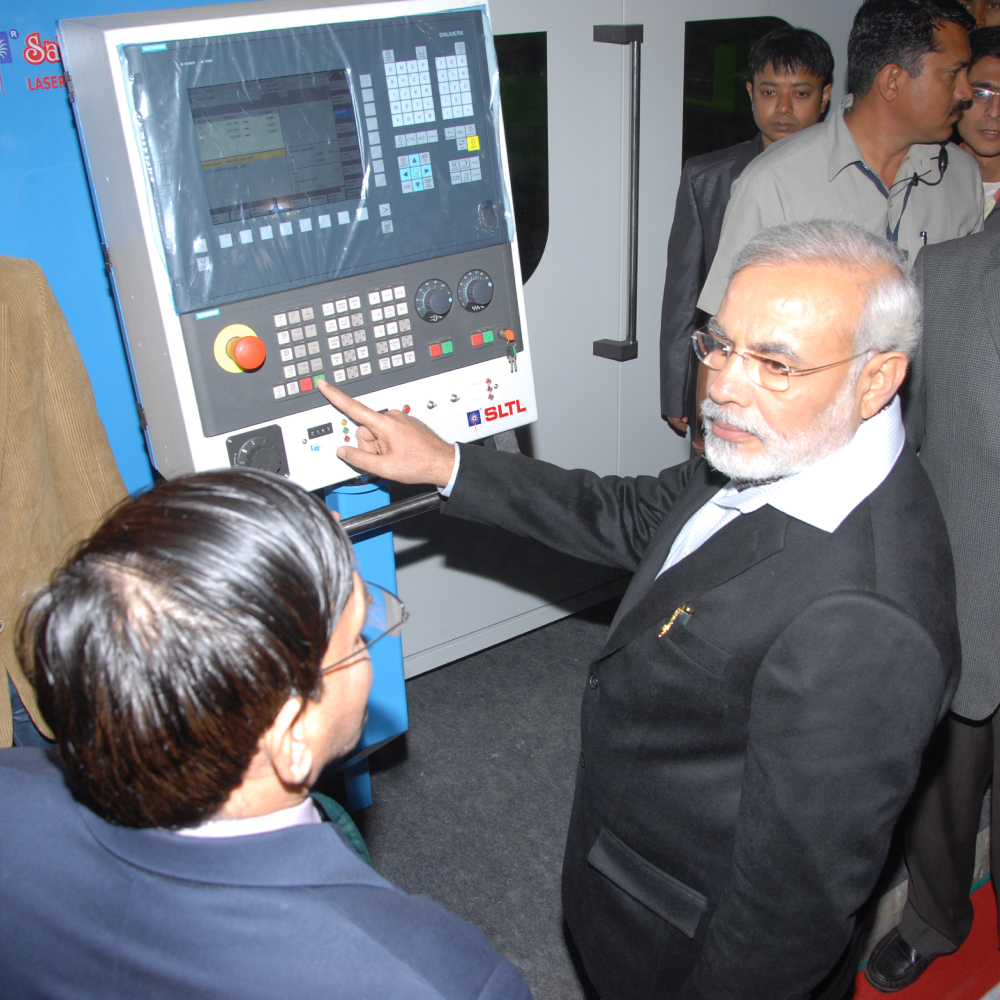 Prime Minister Narendra Modi - Operating SLTL Machine